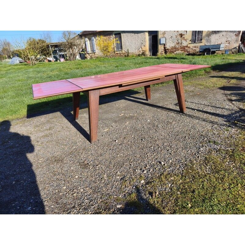 1960s oak dining table with integrated extensions.