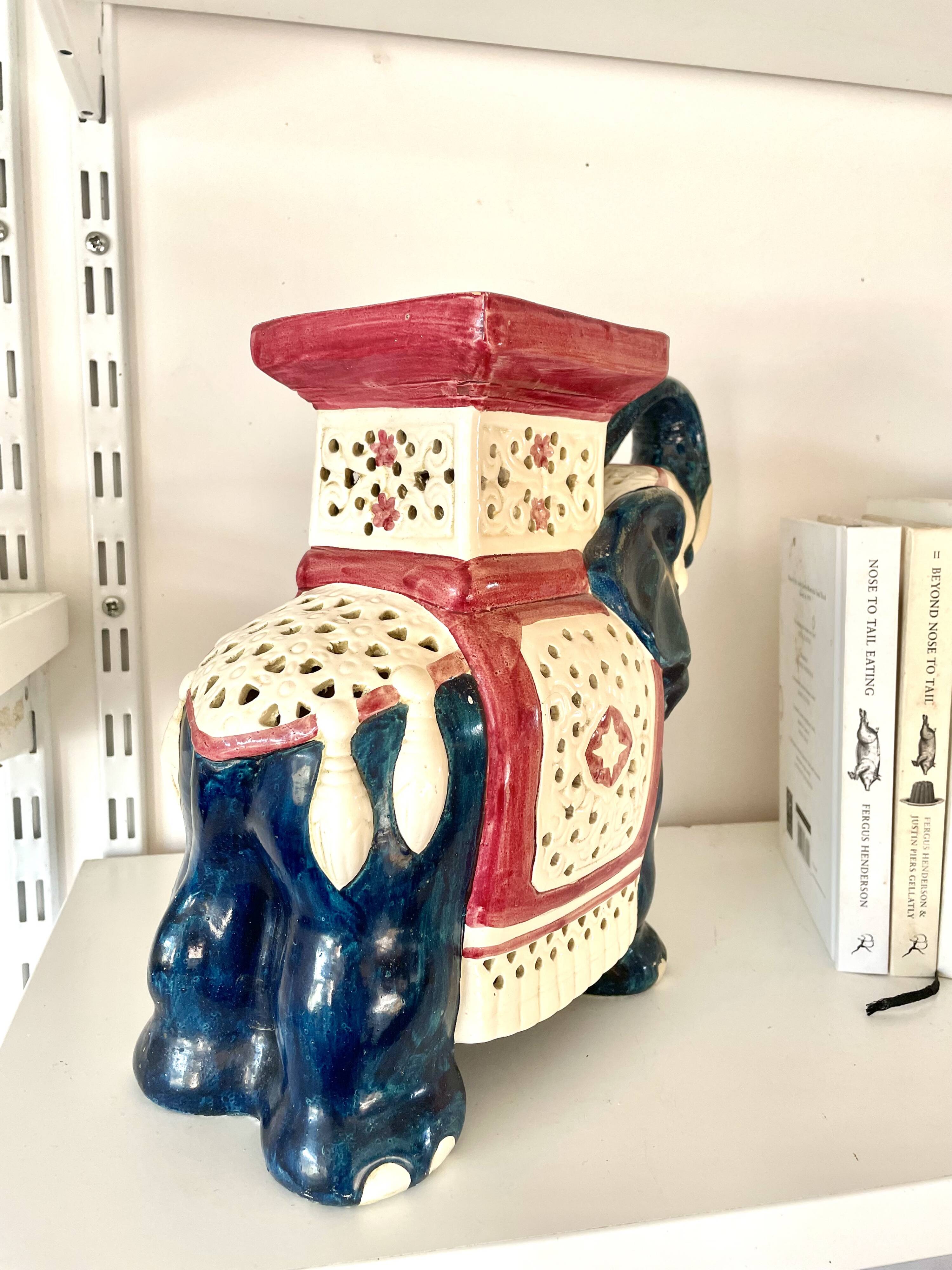 Blue and red ceramic elephant plant stand