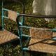 Wrought iron and rattan garden chairs