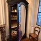 Black wardrobe with a mirrored door in ebony finish.