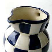 Ancien pichet en faïence à décor Lustucru de fabrication artisanale
