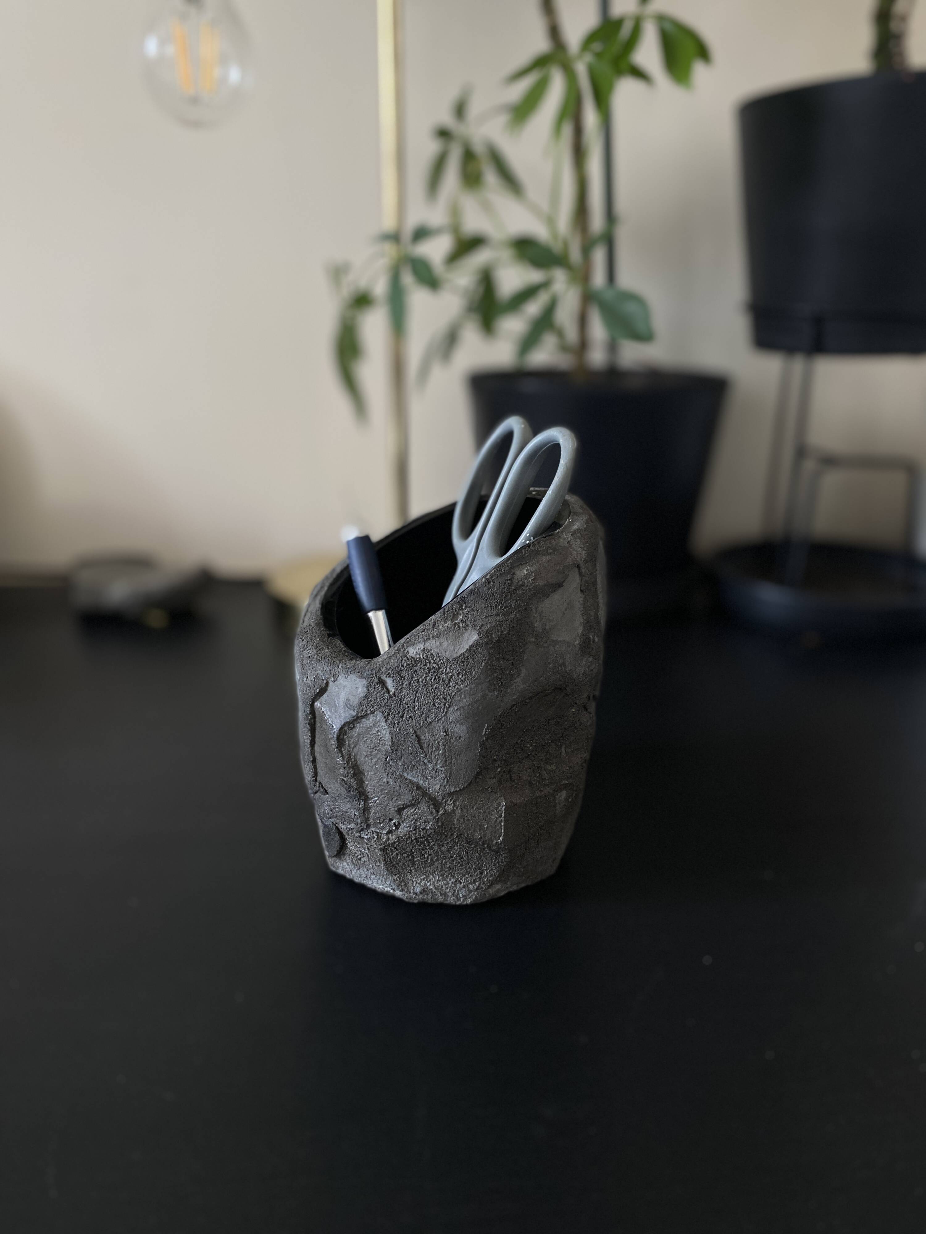 Asymmetrical sculpted concrete vase