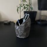 Asymmetrical sculpted concrete vase