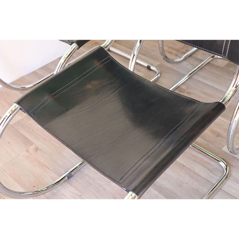 Series of 6 minimalist chairs in chrome metal and black leather around 1970