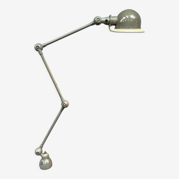 Dark gray three-arm Jielde clamp lamp