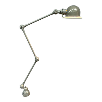Dark gray three-arm Jielde clamp lamp