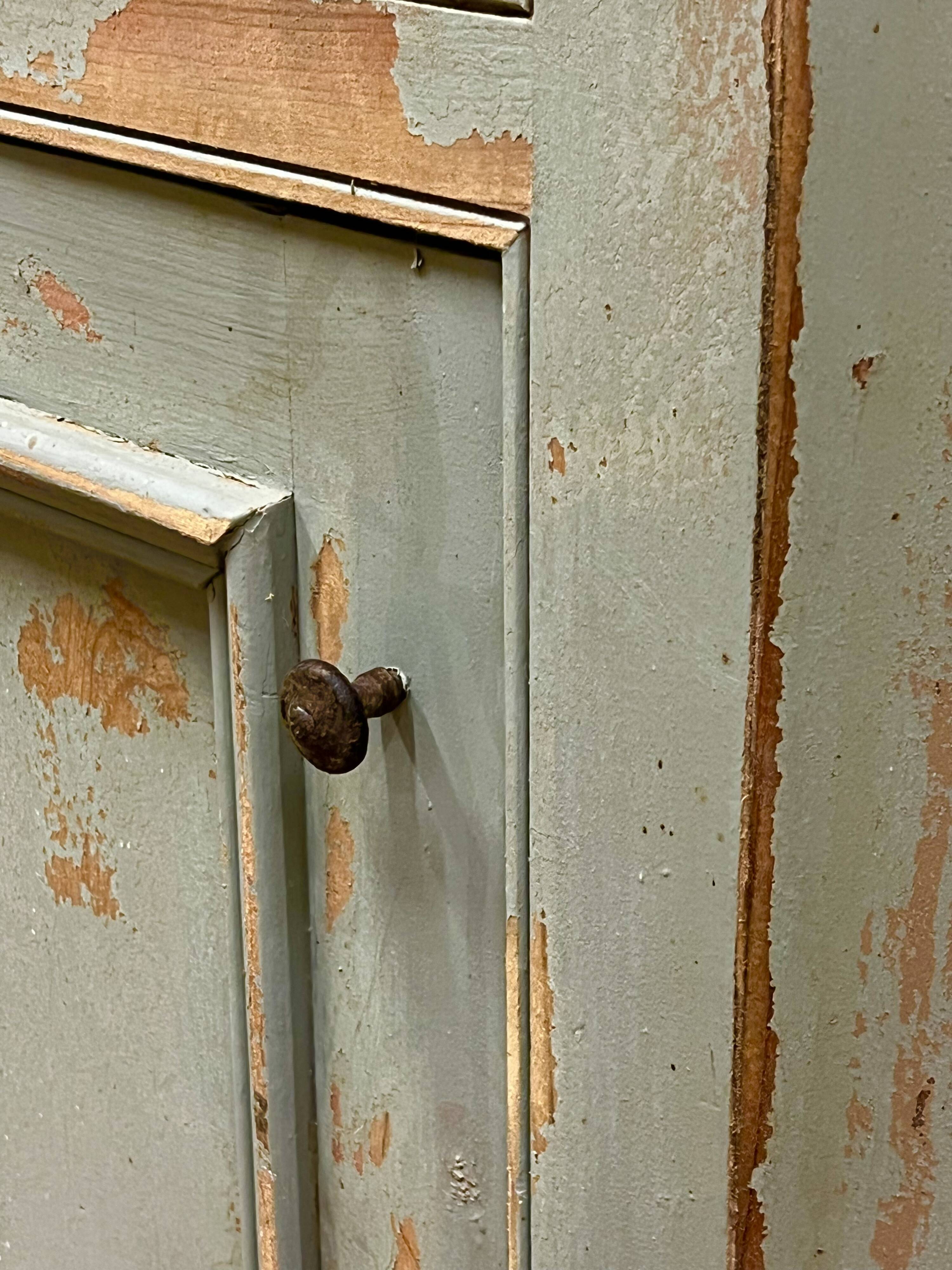 Patinated corner cupboard