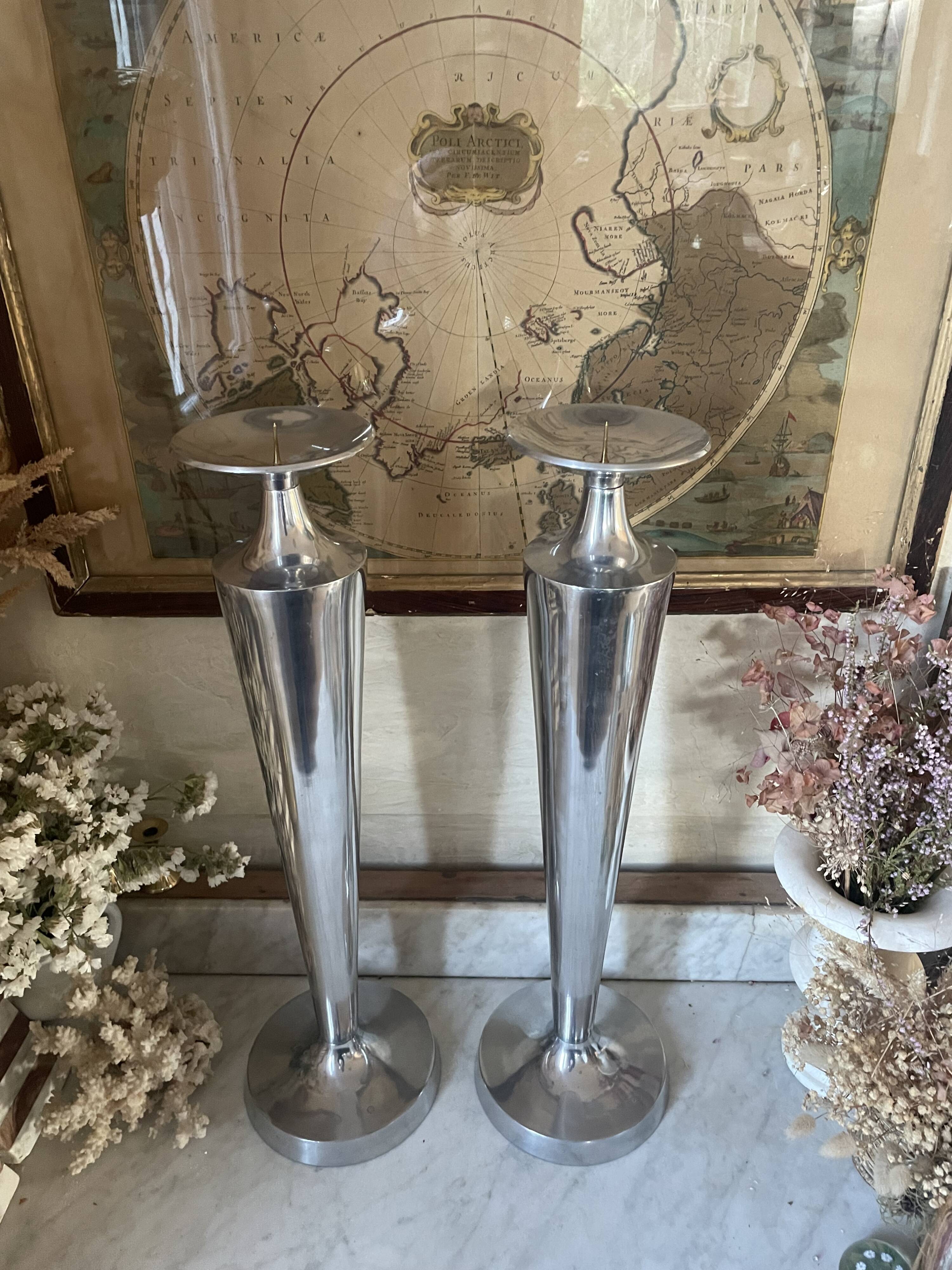 Pair of aluminium cast candle holders 52cm