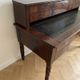 Antique wooden tiered desk with drawers and twisted legs.