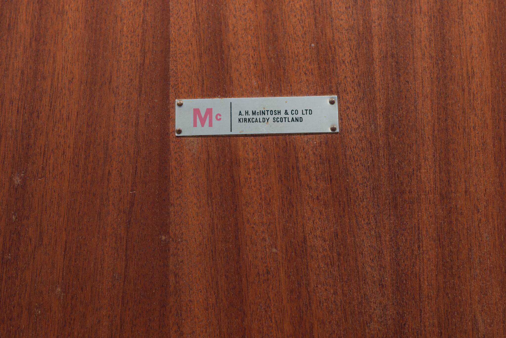 Extendable teak dining table in Mid-Century style from McIntosh, UK.