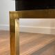 Coffee table in brass and black lacquer by Guy Lefèvre for Maison Jansen
