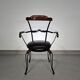 Italian postmodern turnable wrought iron dining chairs with leather seats