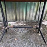 Vintage bistro table with an Art Deco style cast iron base and Formica top.