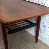 Danish 1960s teak coffee table with slatted shelf.
