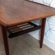 Danish 1960s teak coffee table with slatted shelf.