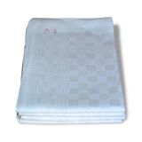 Suite of four former cloths, red AC monograms