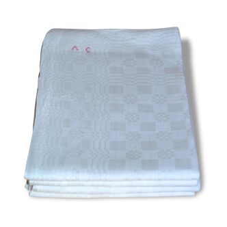 Suite of four former cloths, red AC monograms