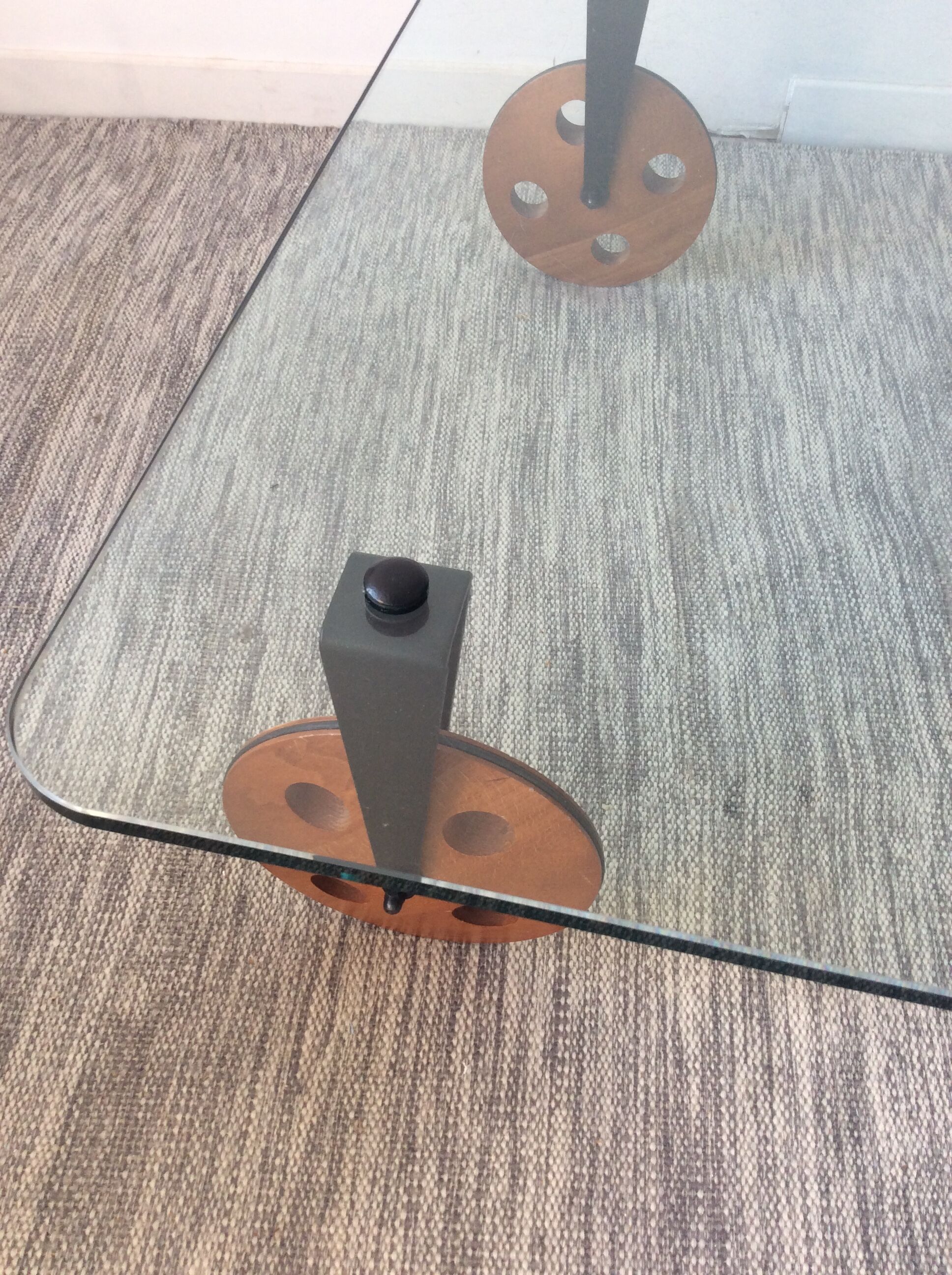 Glass coffee table on teak wheels