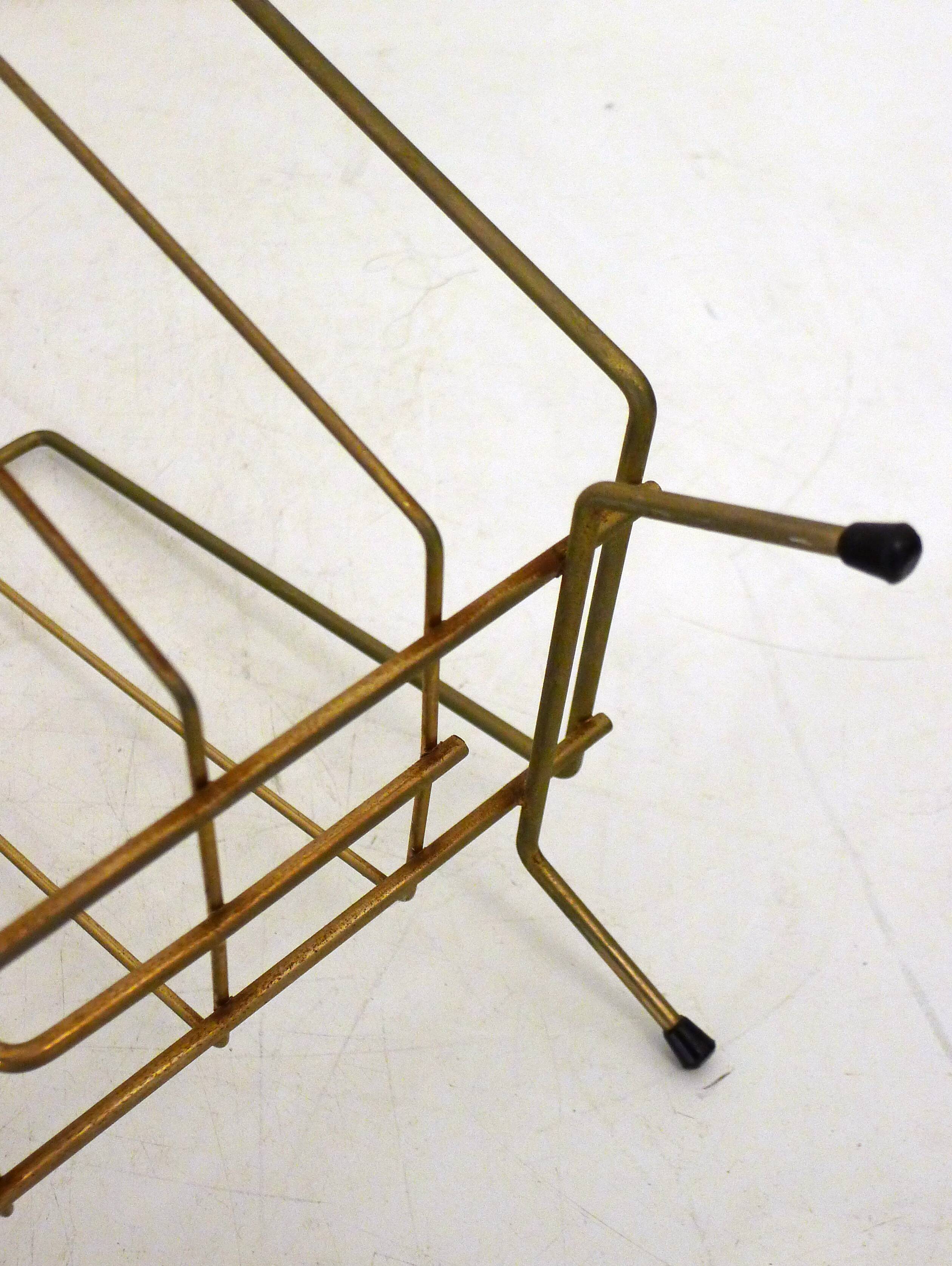 Mid-century openwork magazine rack, in gold metal & wooden handle.