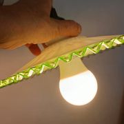 Portable lamp in pale green and white glass