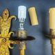 Pair of electrified golden wrought iron gothic wall sconces.