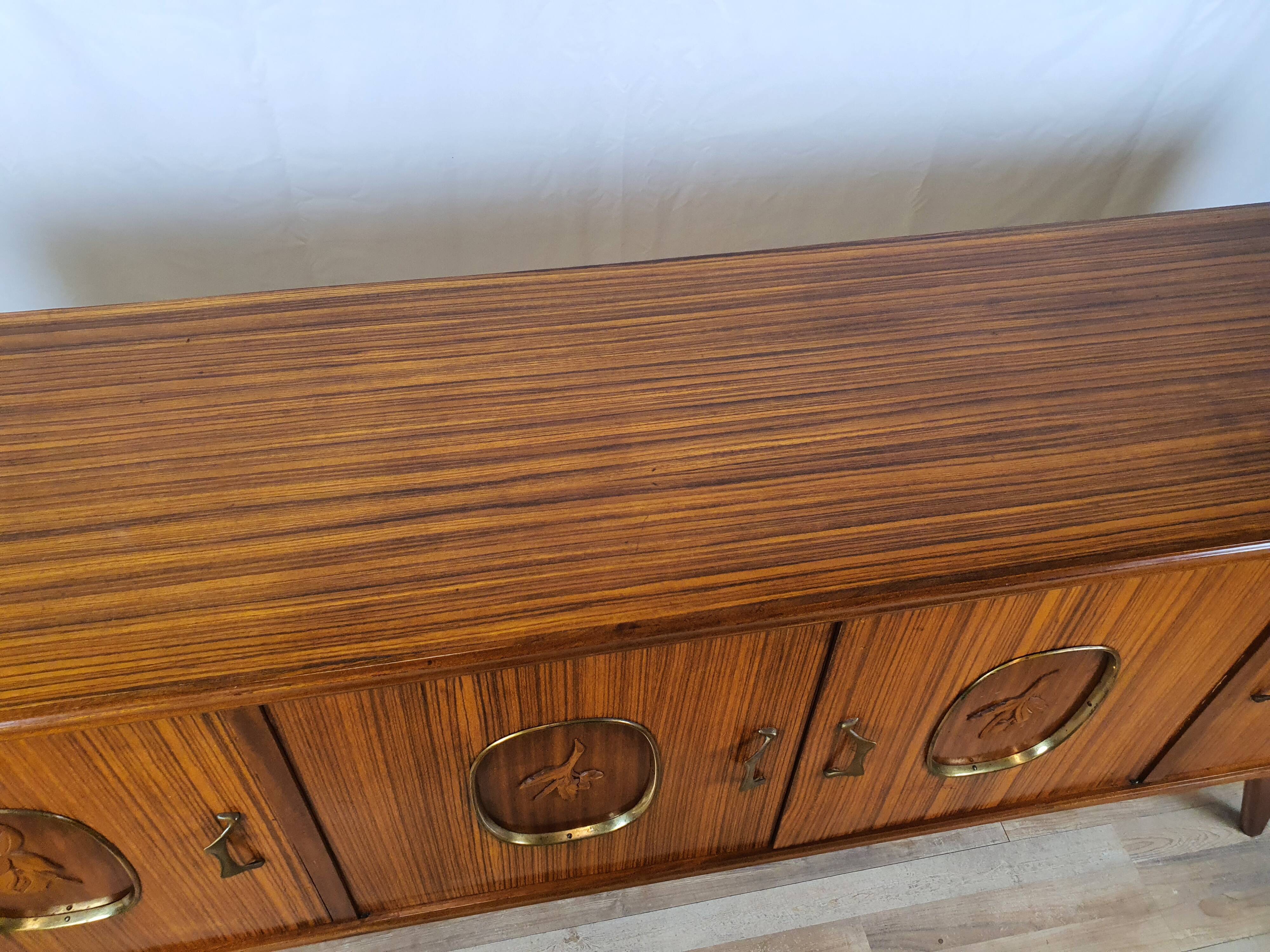 1960s sideboard with decorated doors in wood and brass