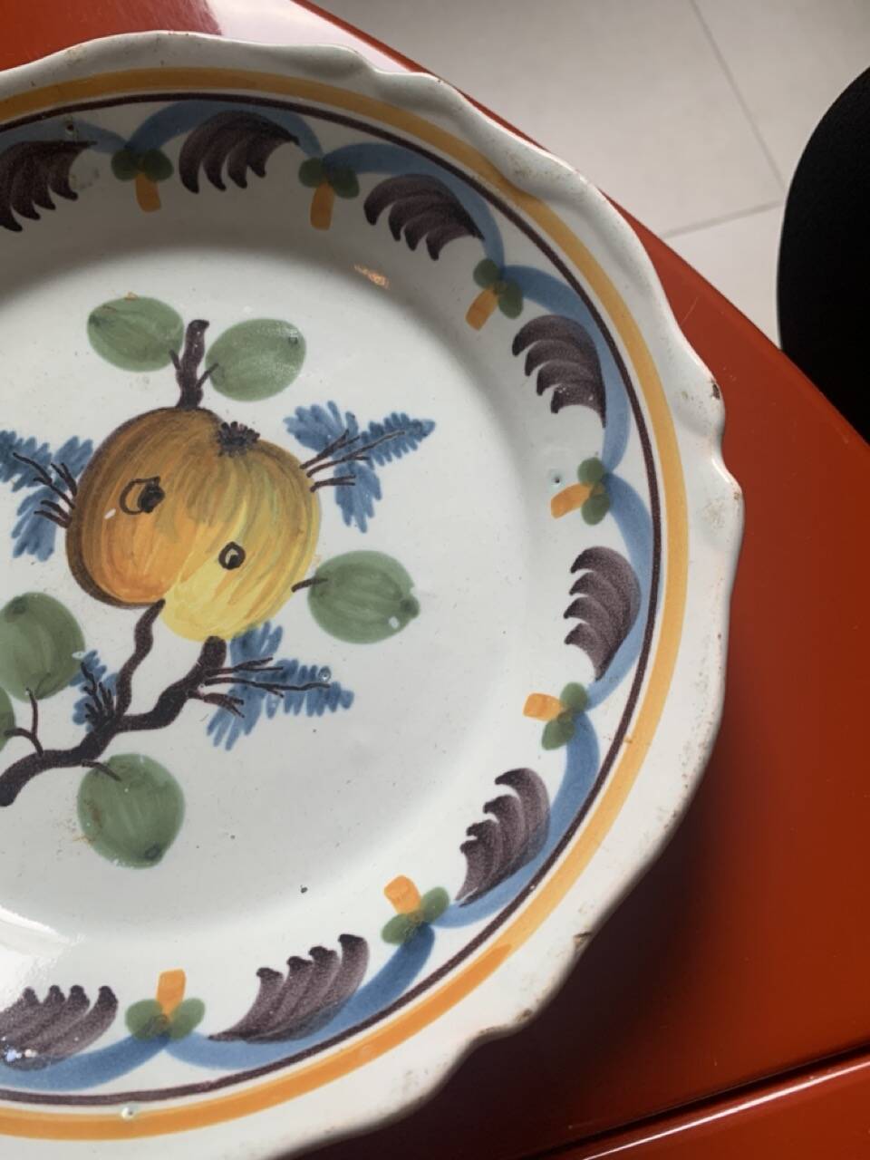 Antique earthenware soup plate with plum decoration