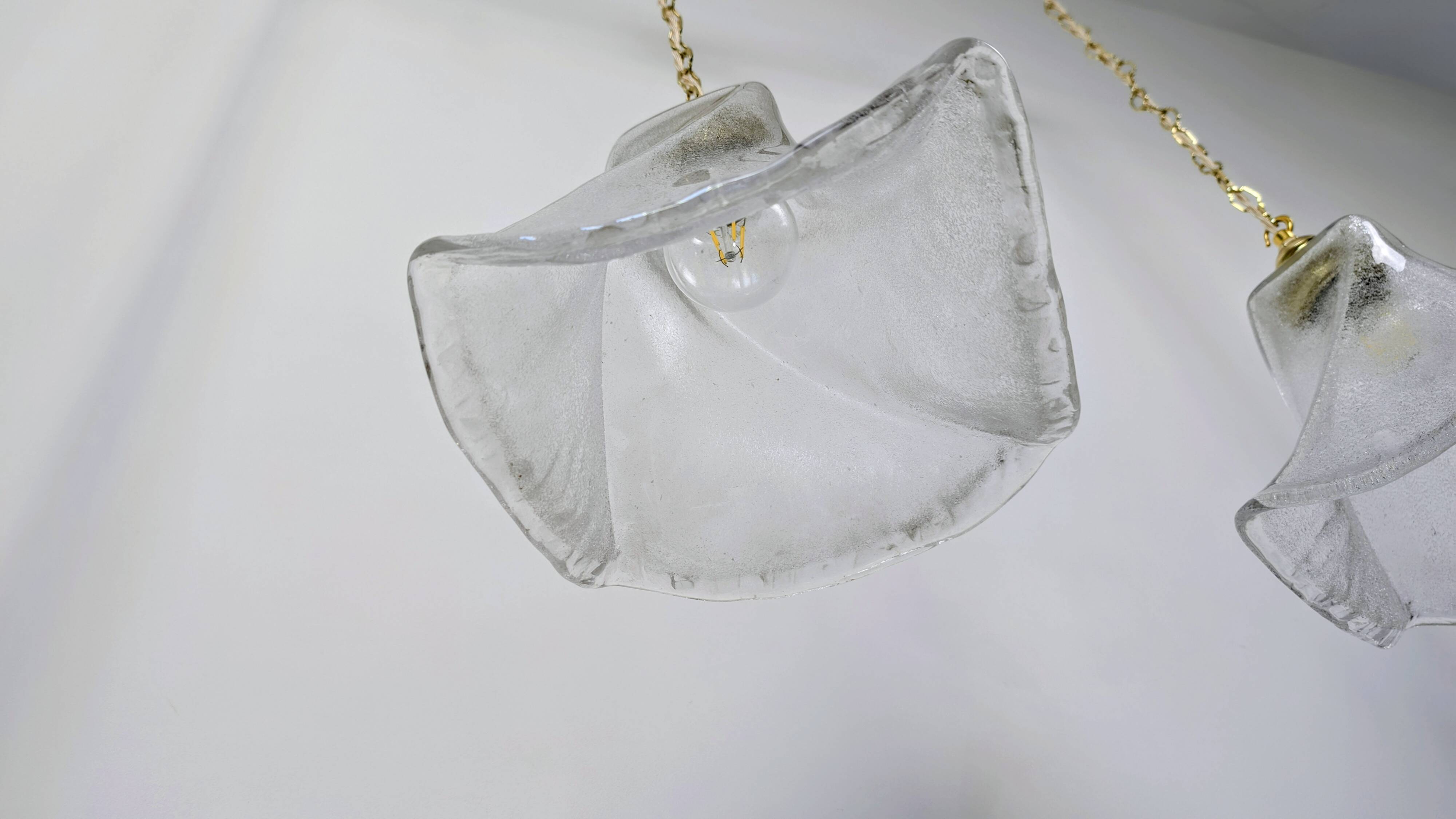 Pair of granite glass and brass pendant lights – poetic elegance