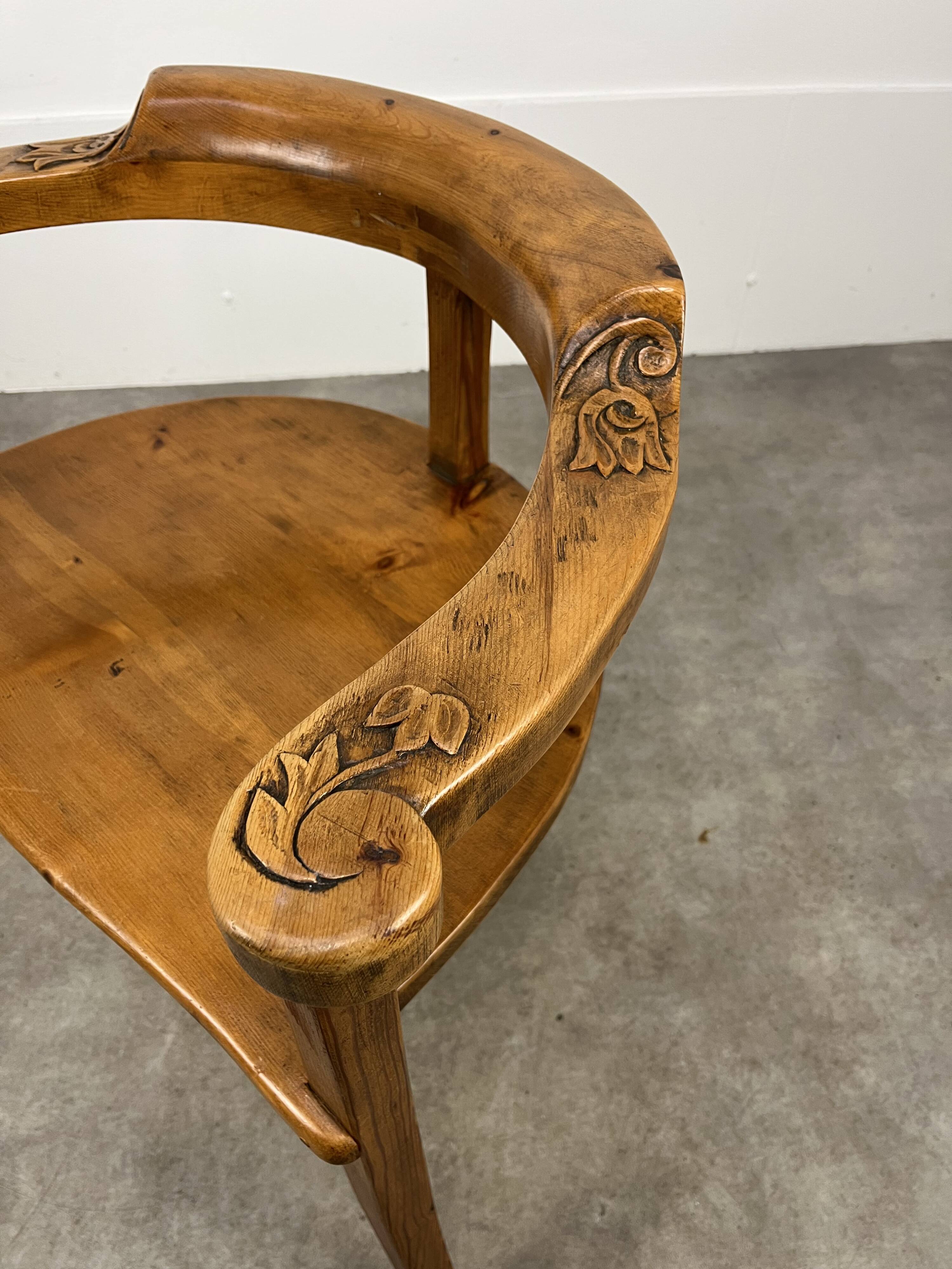 Chalet-style carved wooden tripod armchair