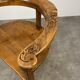 Chalet-style carved wooden tripod armchair