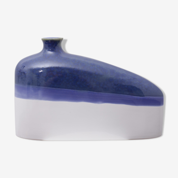 Blue and white elongated earthenware vase
