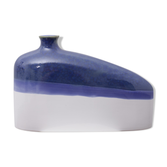 Blue and white elongated earthenware vase