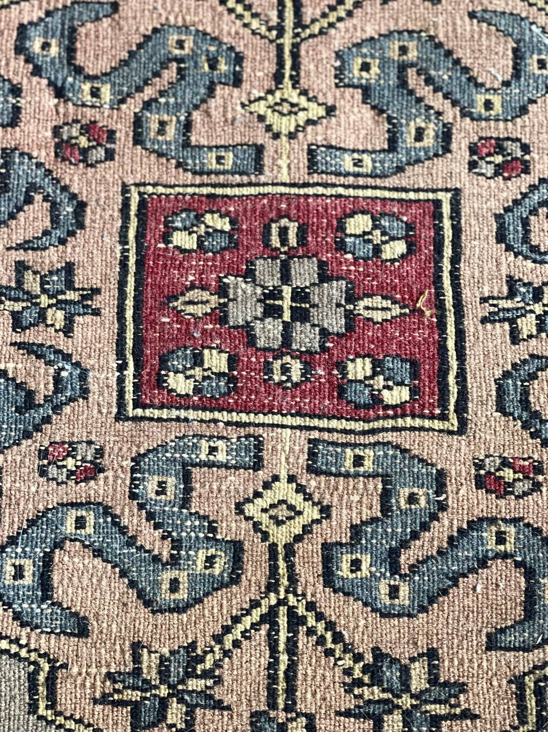 Antique Persian rug, signed.