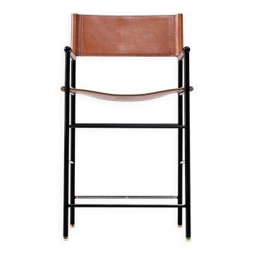Contemporary classic bar stool with natural brown leather backrest, black metal frame.