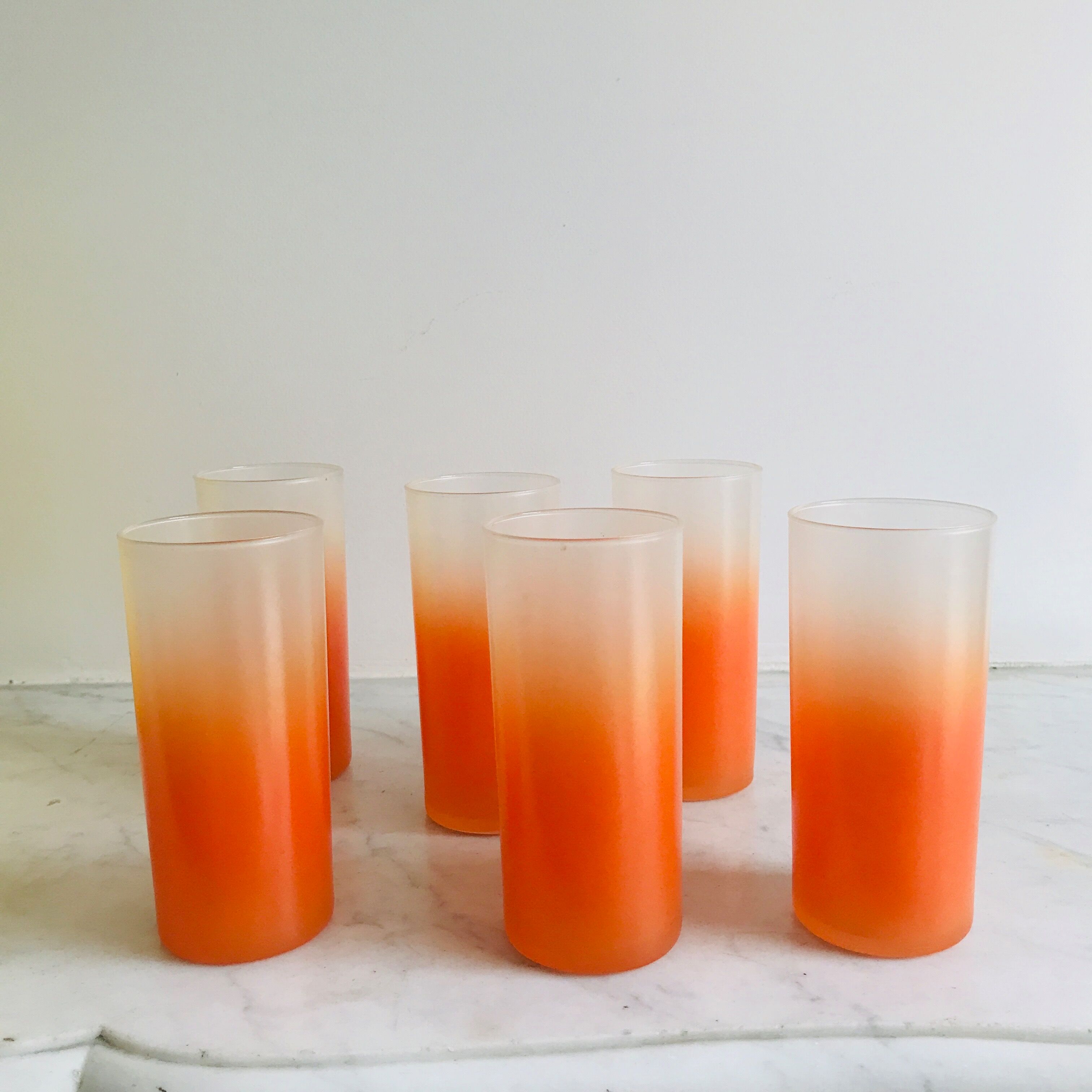 6 orangeades glasses in their basket