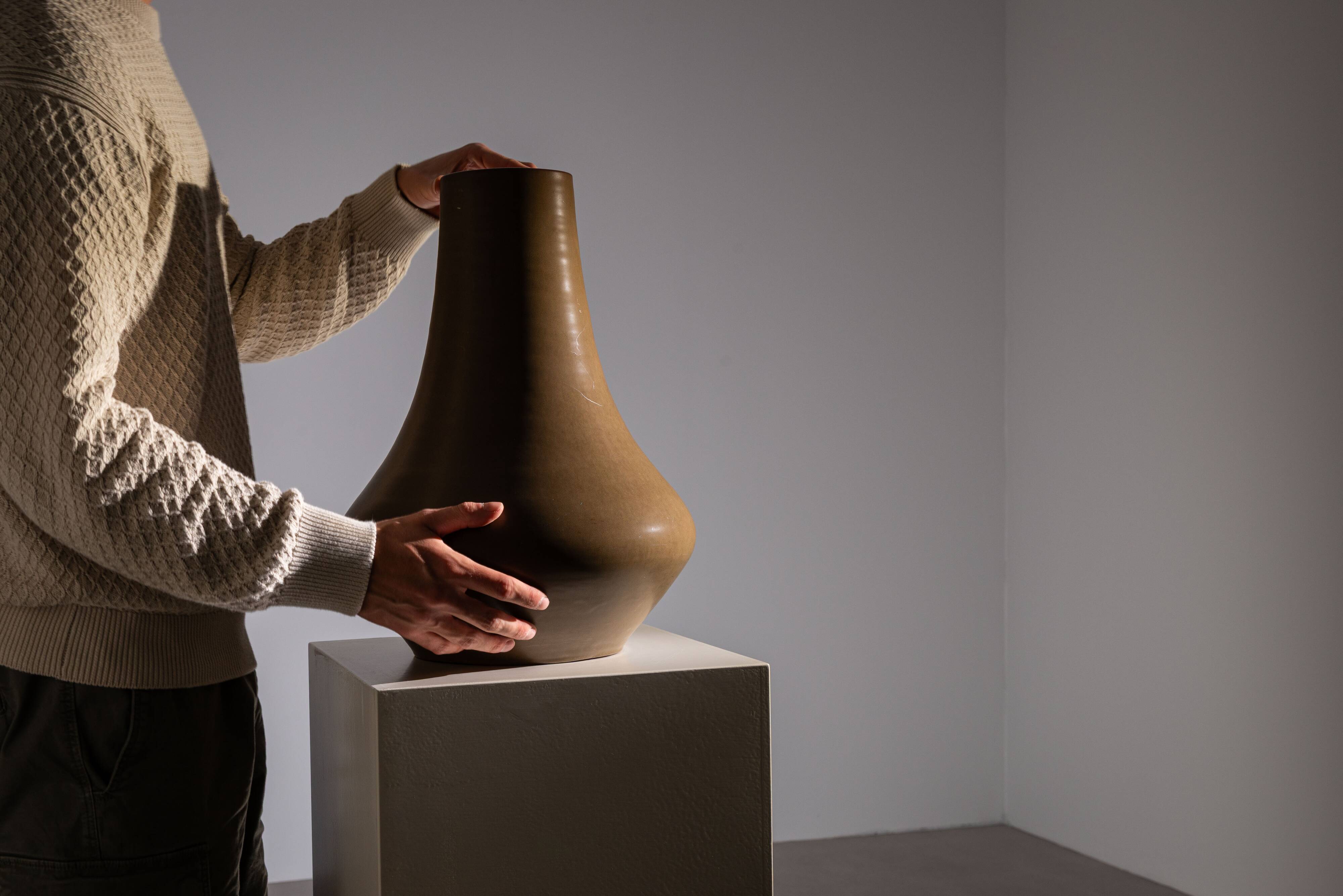 Minimalist curved stoneware vase in matte sand finish