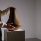 Minimalist curved stoneware vase in matte sand finish