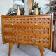 Vintage wooden and rattan chest of drawers with tapered legs.
