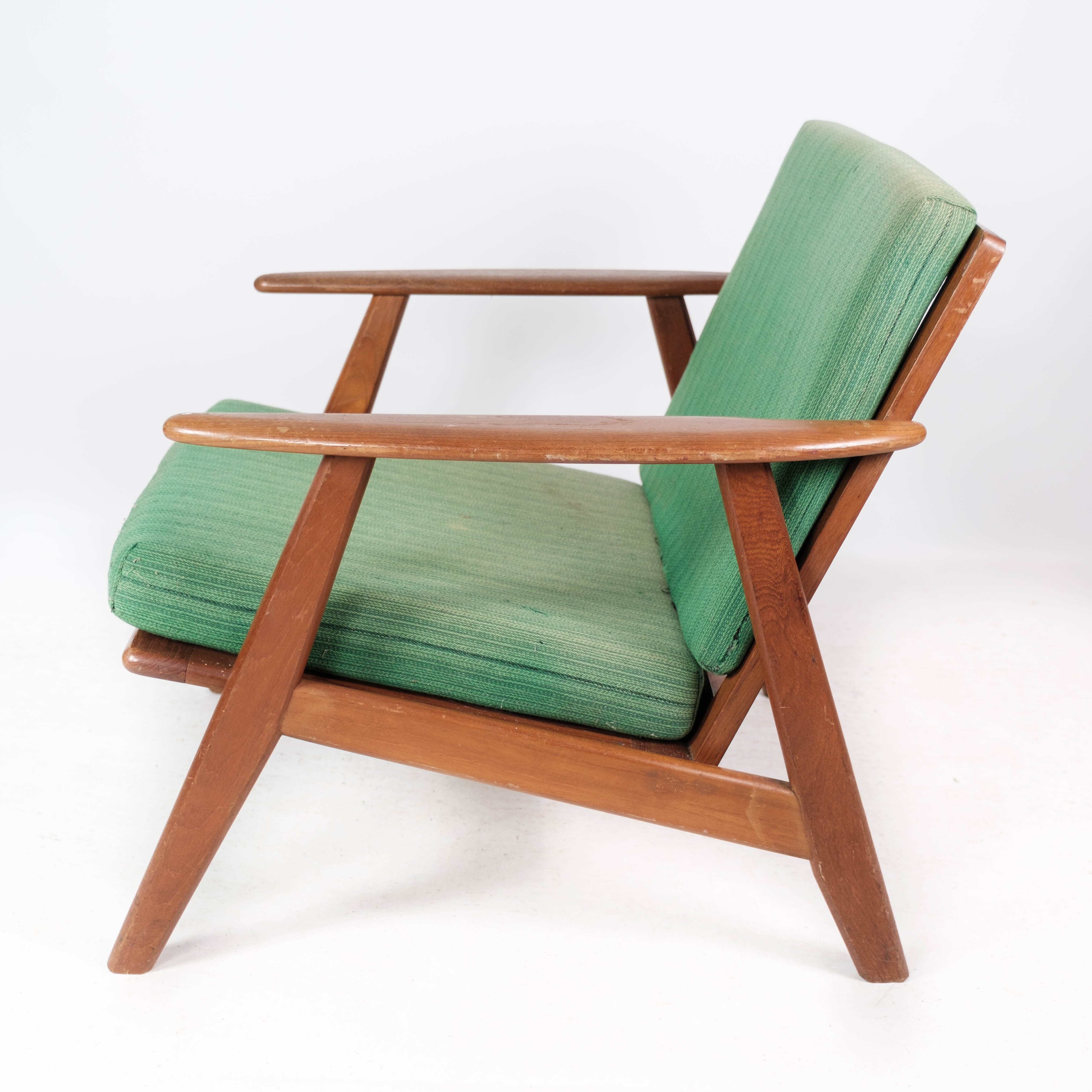 Easy chair in teak and with green upholstery of Danish design, 1960s