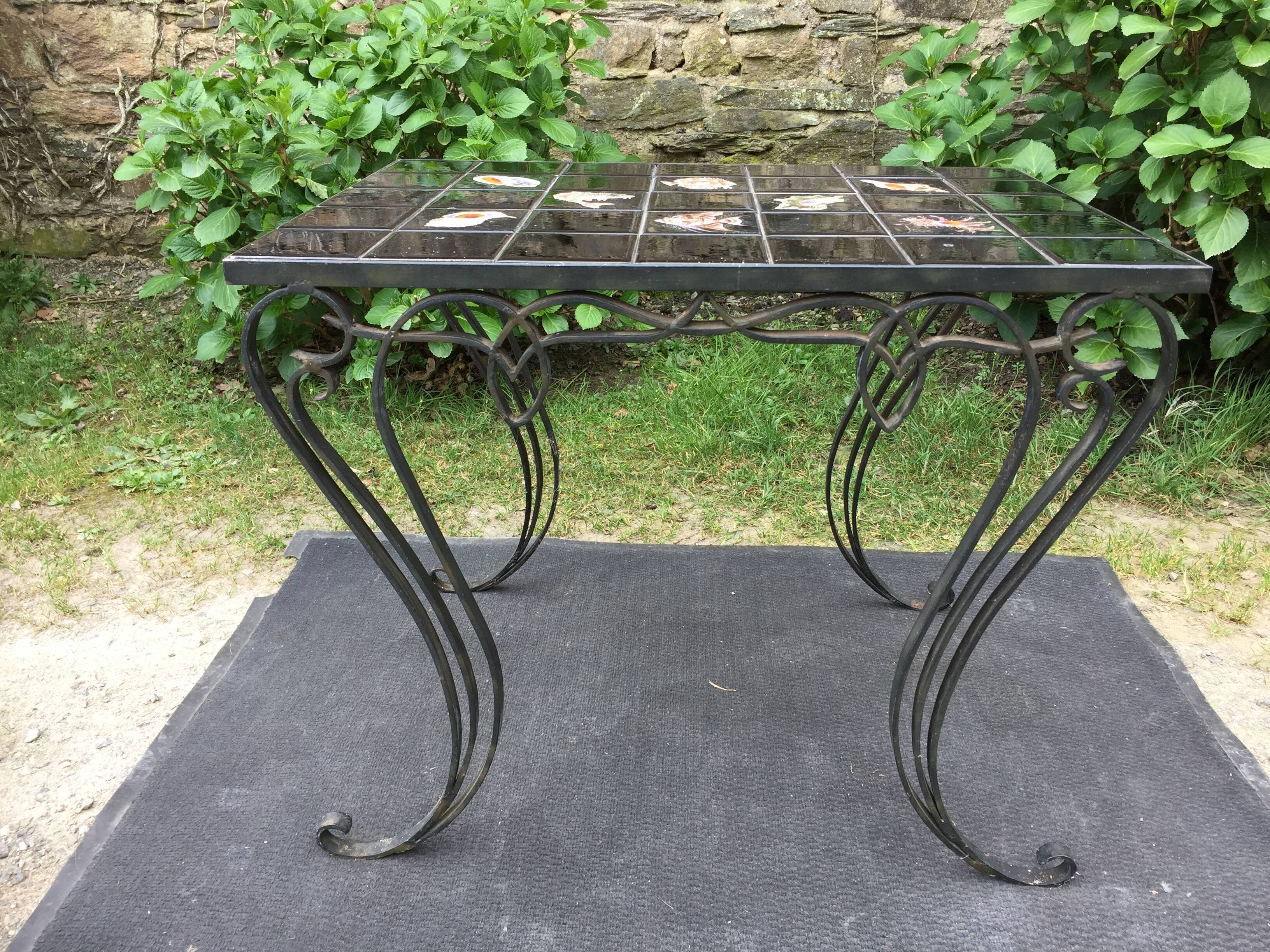Vintage ceramic coffee table by Guy Trévoux with wrought iron base.