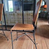 Glass and metal table and its 4 wicker chairs and glass Roche Bobois