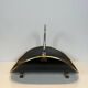 Neoclassical log holder in brass and black lacquered brass