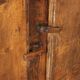 Antique pine wardrobe painted in walnut stain, restorations, Italy, 17th century.