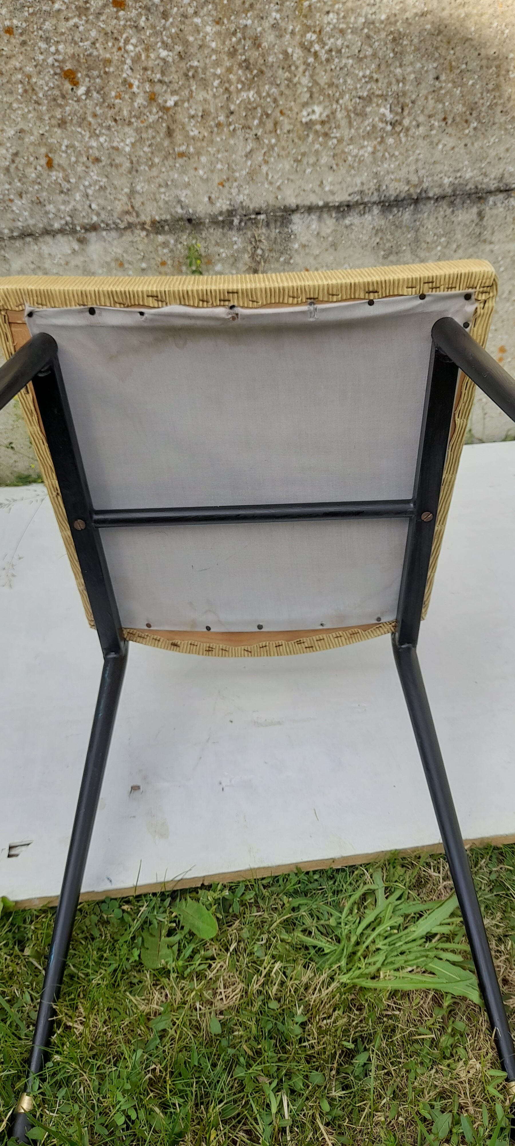 Black metal chair and yellow imitation leather seat