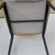 Black metal chair and yellow imitation leather seat