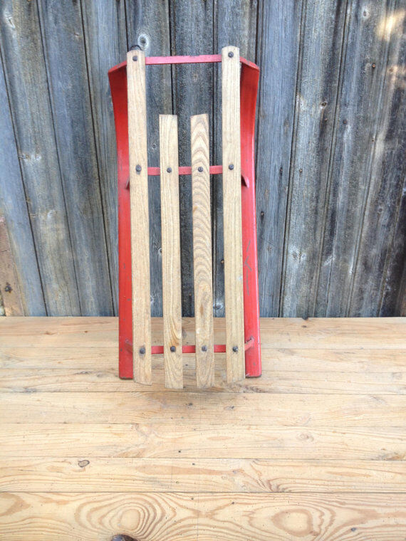 Red sled in metal and wood in the 1960s