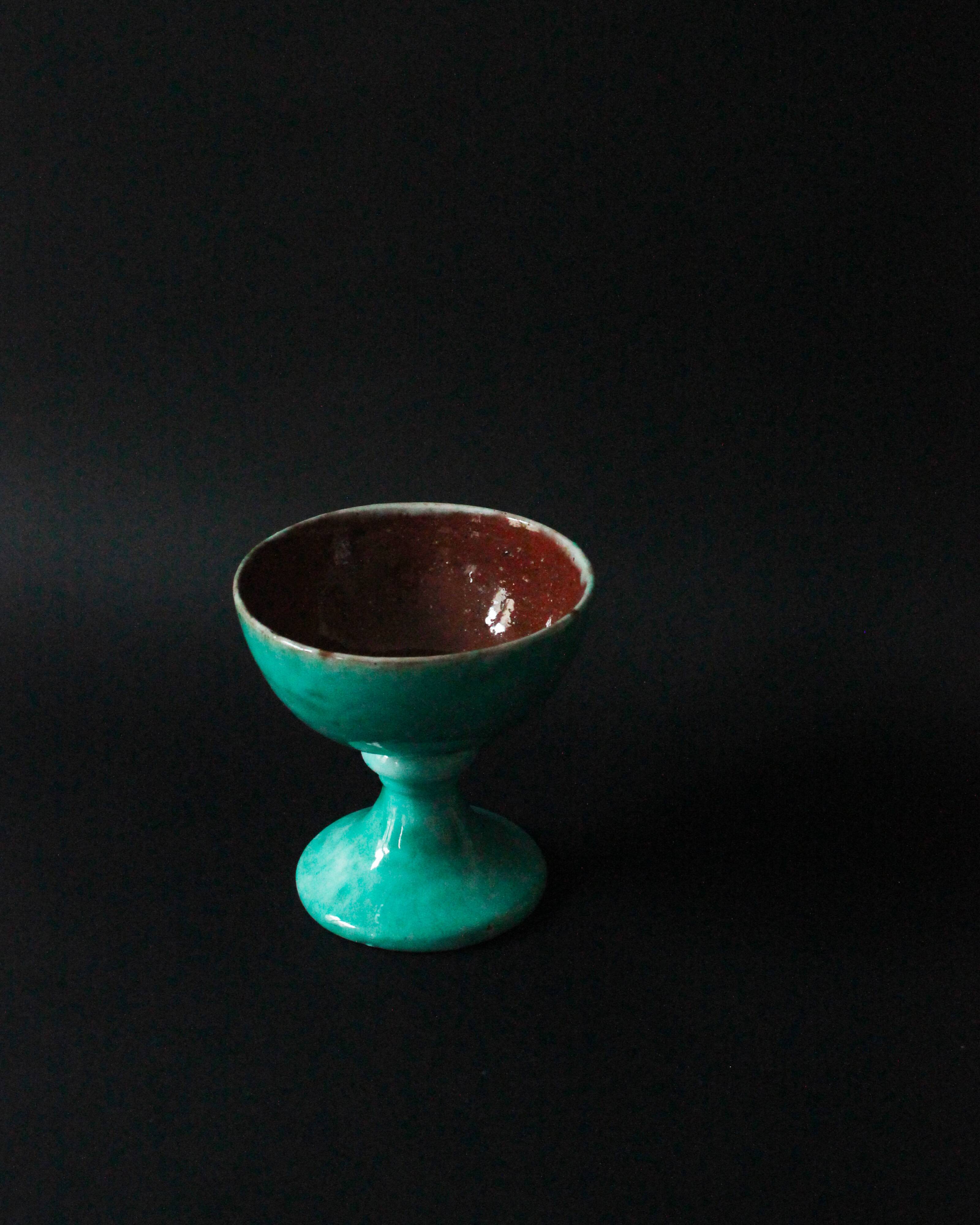 Cup on a pedestal or chalice in cloudy lagoon green glazed terracotta