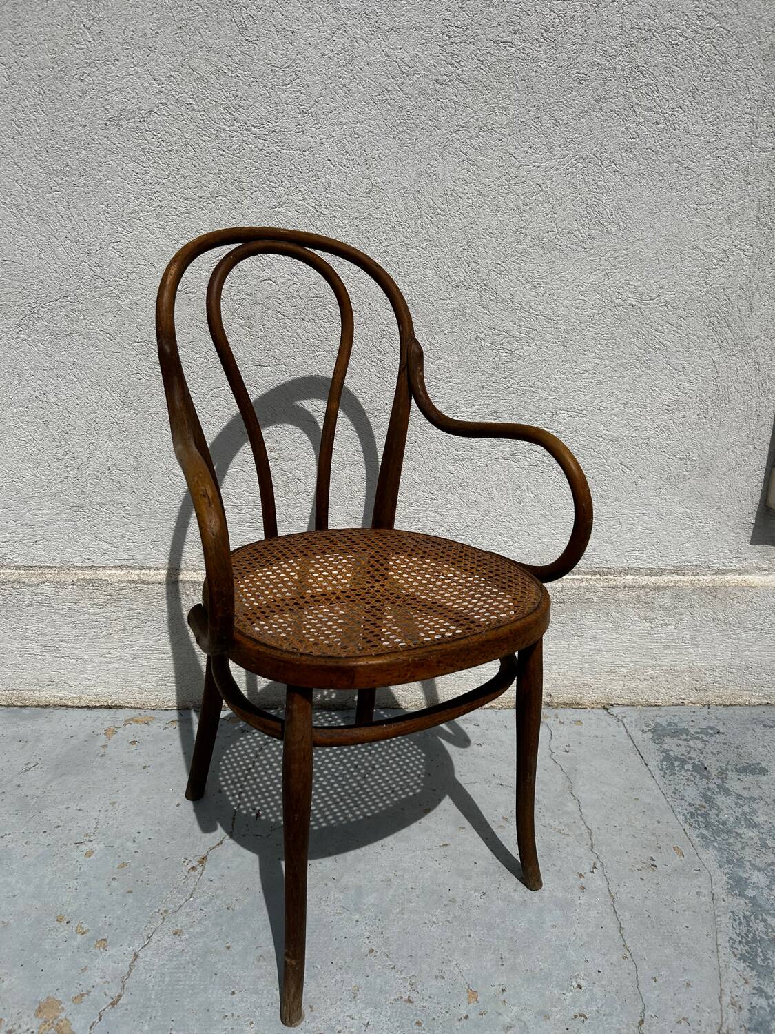 Fauteuil Thonet bois courbé et cannage – modèle bistrot