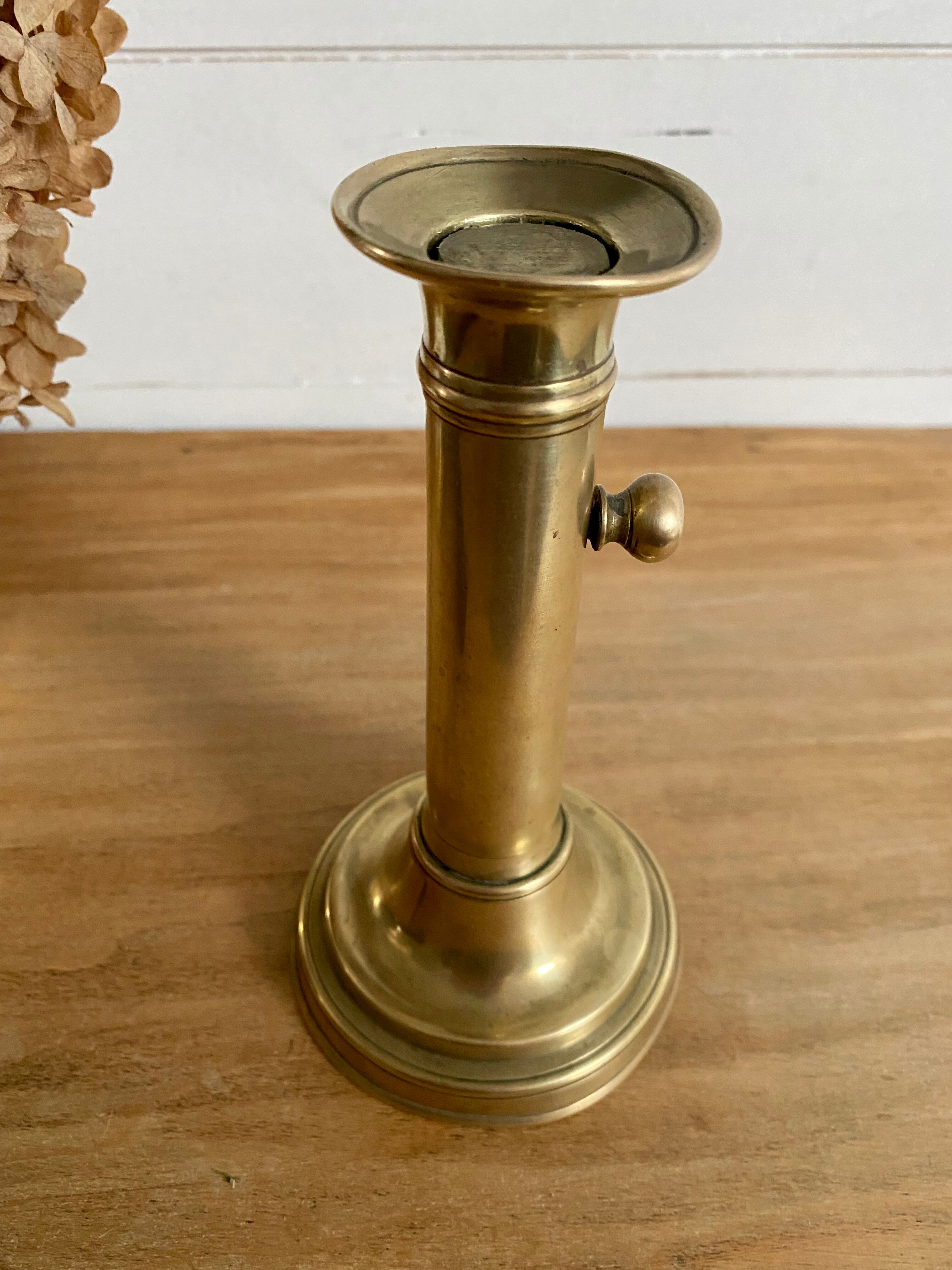 Nineteenth-century brass pull-out candle holder
