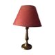Table lamp at the foot candlestick